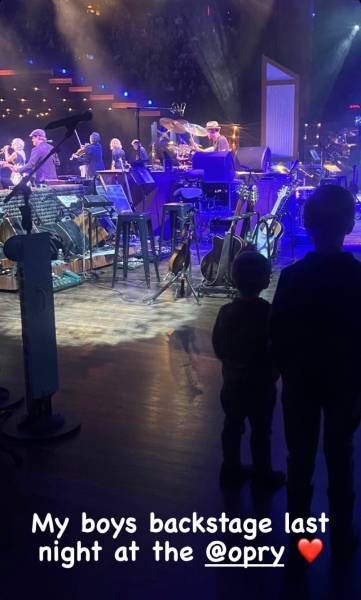 Carrie Underwoods sons watching her from backstage as she performs at the Grand Ole Opry