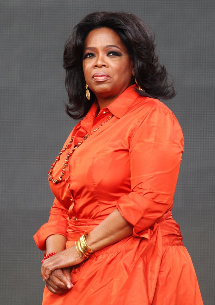 oprah winfrey orange dress on stage