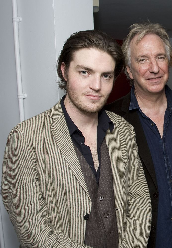 Alan Rickman and Tom Burke pose together 