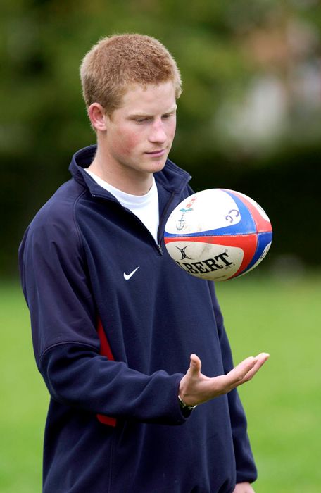 prince harry with a rugby ball