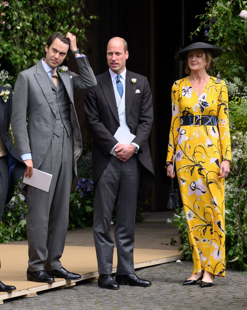 Prince William stands between William van Cutsem and Rosie van Cutsem as they depart after attending the wedding of The Duke of Westminster and Olivia Grosvenor