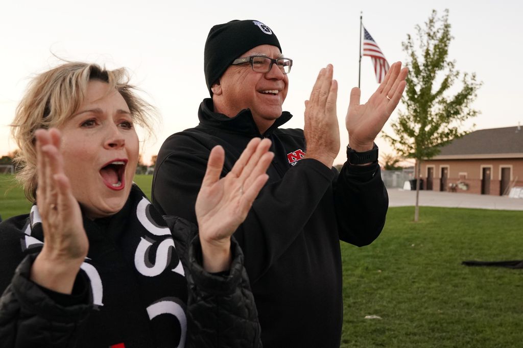 Tim Walz and his wife Gwen cheer for their daughter Hope at the start of her soccer game Tuesday, September 25, 2018