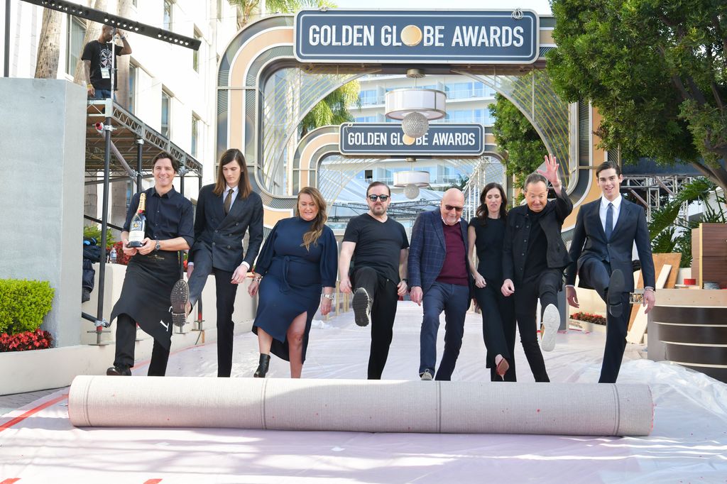 Dylan Brosnan, Amy Thurlow, Ricky Gervais, Lorenzo Soria, guest, Barry Adelman and Paris Brosnan roll out the red carpet at the 77th Annual Golden Globe Awards Preview Day at The Beverly Hilton Hotel on January 03, 2020 in Beverly Hills, California