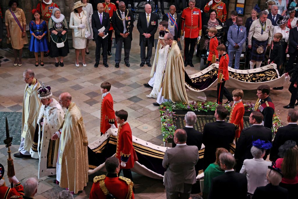 The King and Queen in their robes as they leave Westminster Abbey after their coronation