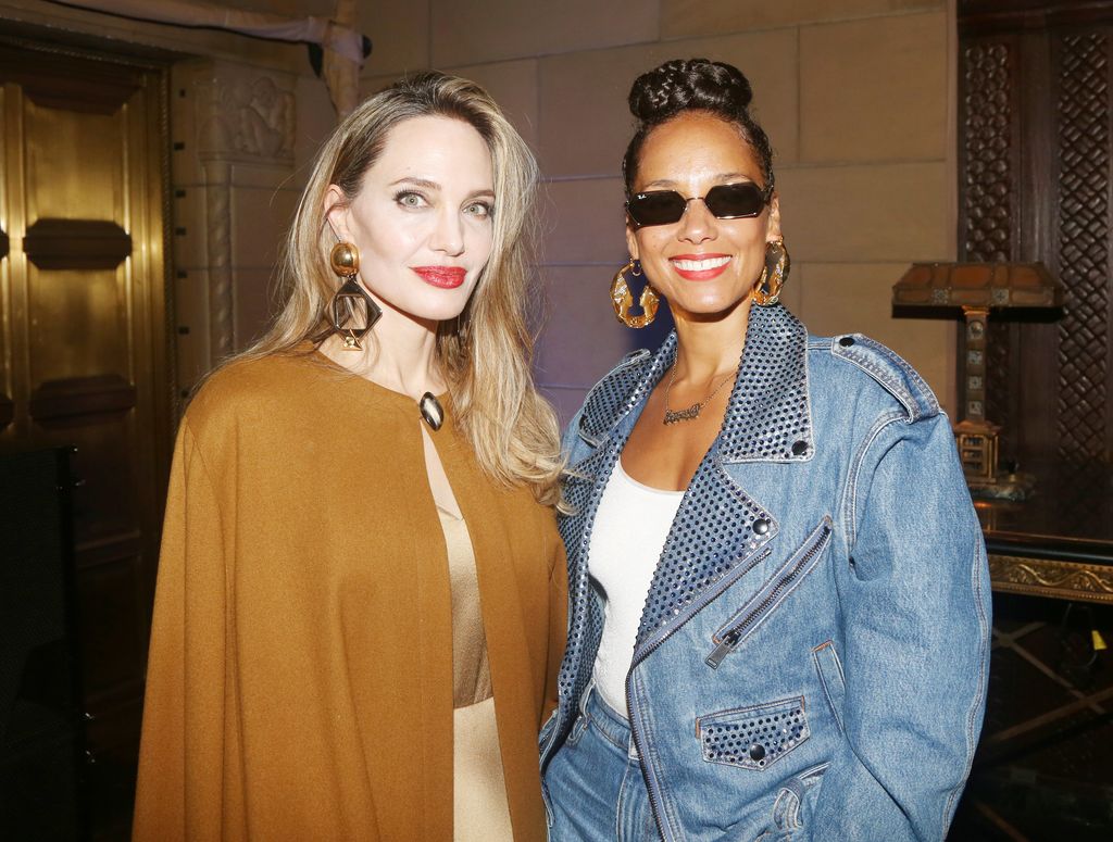 Producer Angelina Jolie and Alicia Keys pose at the opening night after party for the new musical based on the classic novel "The Outsiders" on Broadway at Cipriani 42nd Street on April 11, 2024 in New York City.