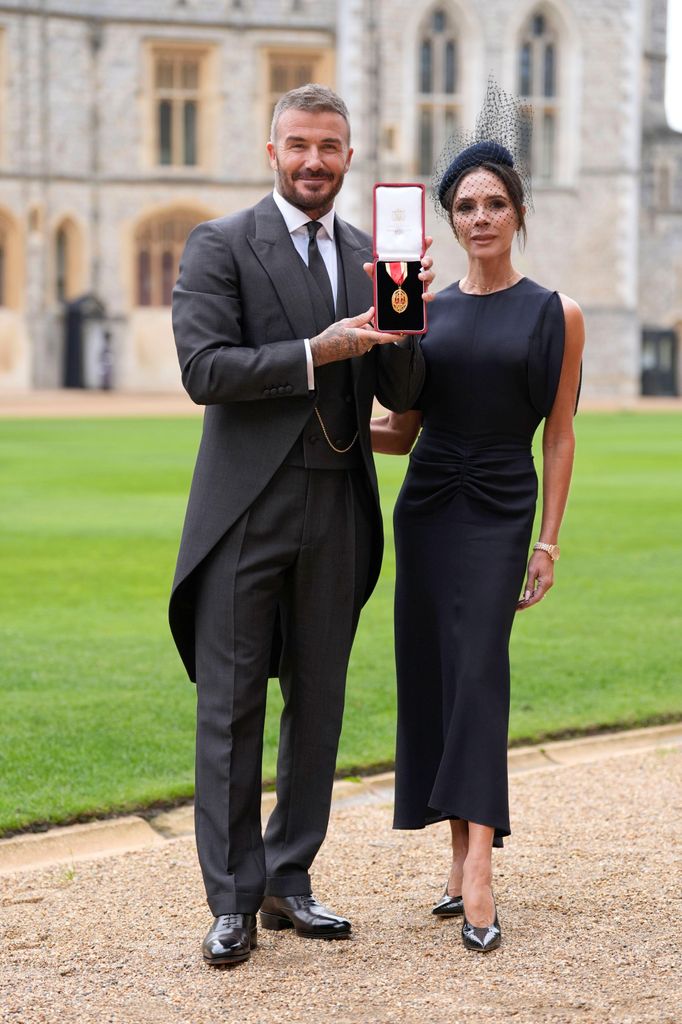 Sir David Beckham, with his wife Lady Victoria, after he was made a Knight Bachelor at an investiture ceremony at Windsor Castle, Berkshire