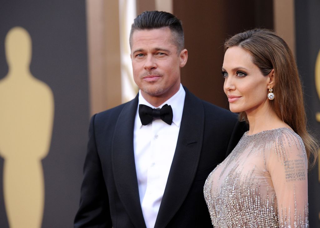 Brad Pitt and Angelina Jolie arrive at the 86th Annual Academy Awards at Hollywood & Highland Center on March 2, 2014 in Hollywood, California.