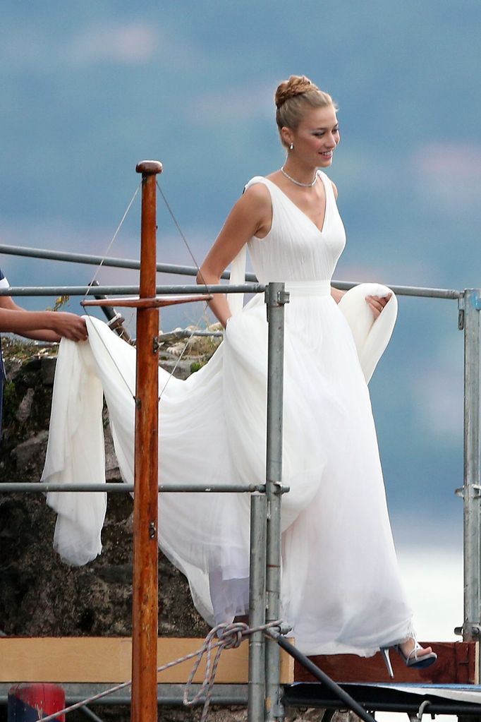 Beatrice Boromeo in white gown on boat