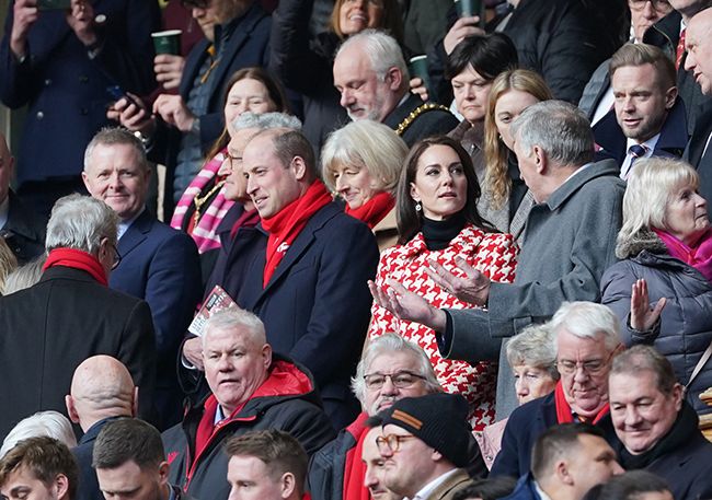 Prince William and Kate Middleton in crowd of people