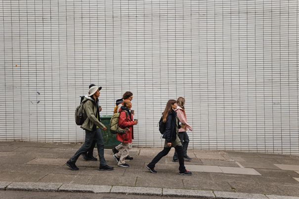 group of people walking in the city