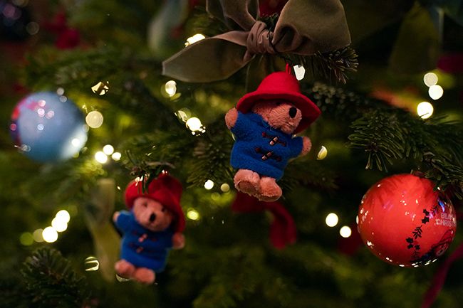 A close up photo showing several Paddington bears in a christmas tree