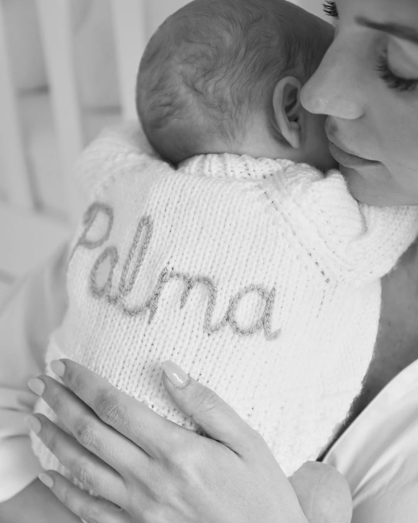 Michelle Keegan hugging her daughter in a knit jumper embroidered with her name