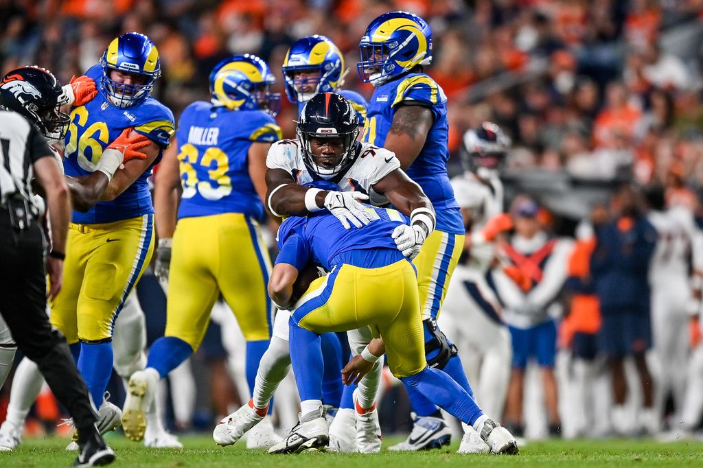 Quarterback Brett Rypien #11 of the Los Angeles Rams is sacked by linebacker Aaron Patrick #94 of the Denver Broncos