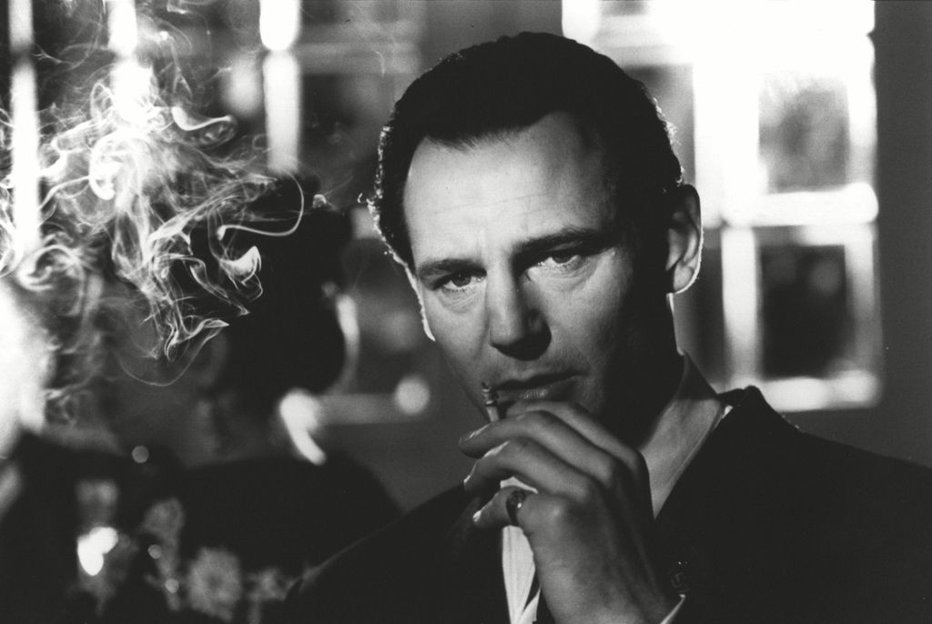 Liam Neeson smokes a cigarette in Schindler's List
