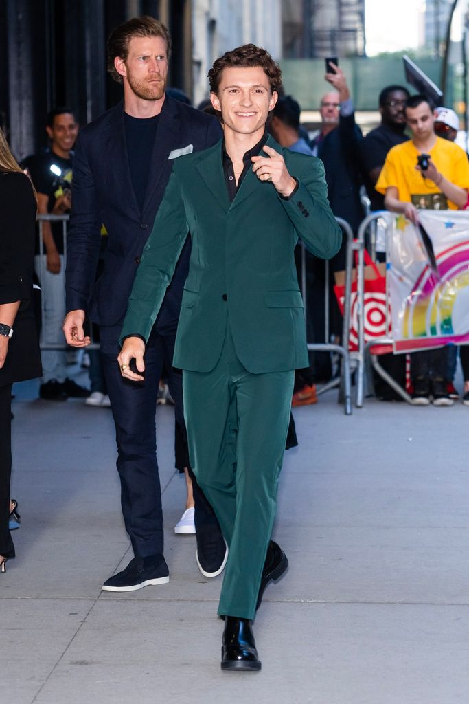 tom holland in a green suit