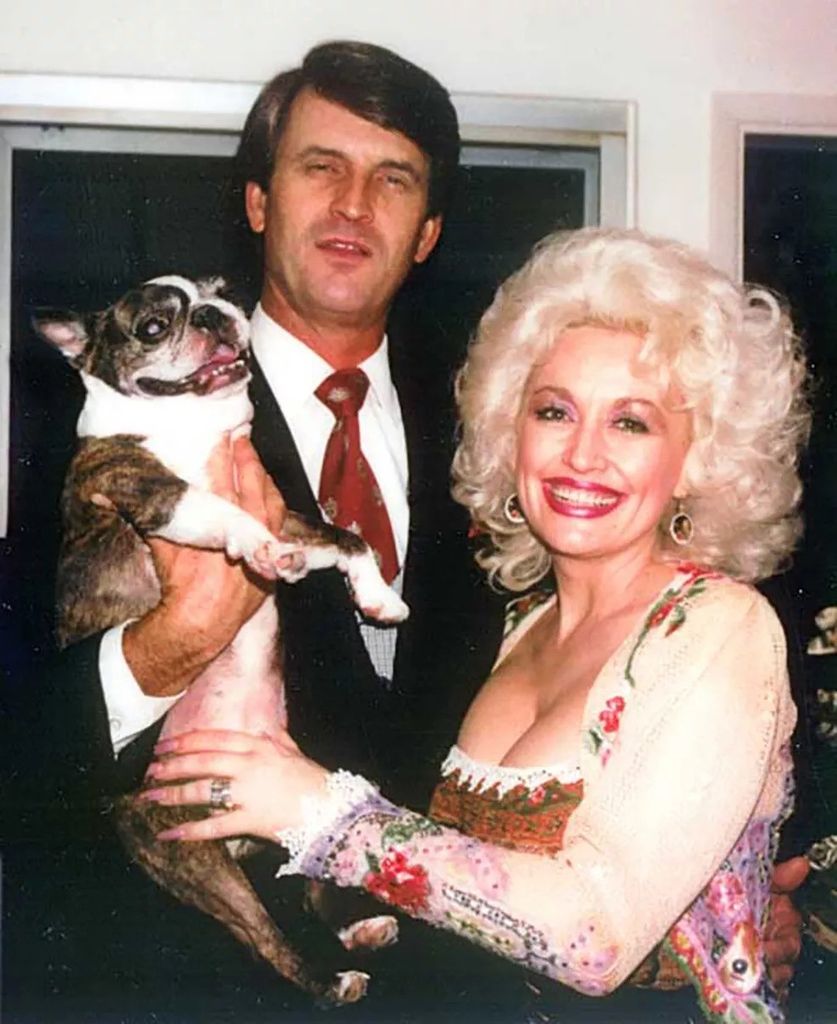 dolly parton and carl dean throwback holding dog