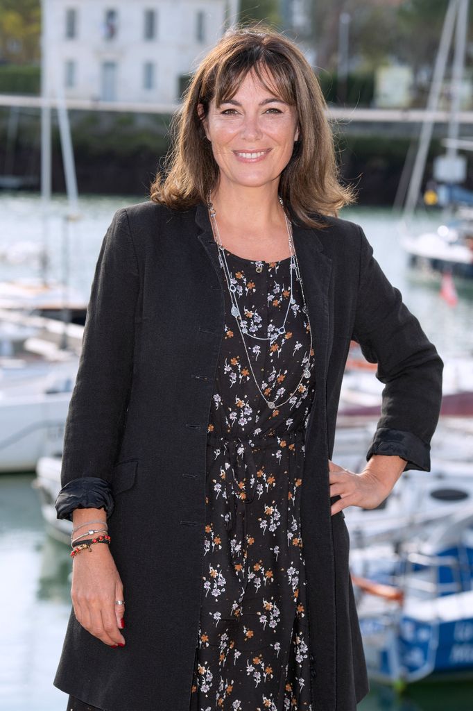 woman posing for photo on harbour