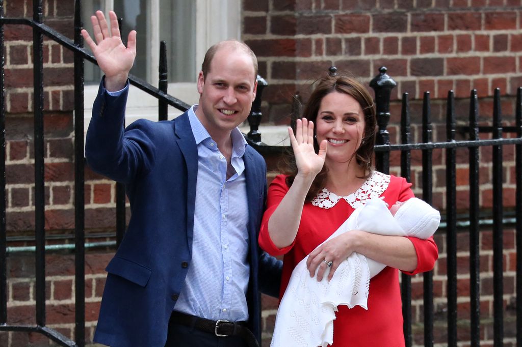 Prince William and Kate Middleton waving with Kate carrying Prince Louis