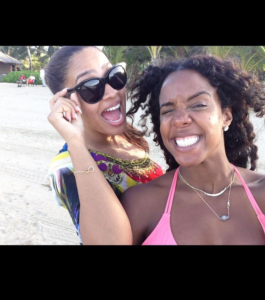 Kelly Rowland looked stylish as she posed in a pink bikini with friend Lala