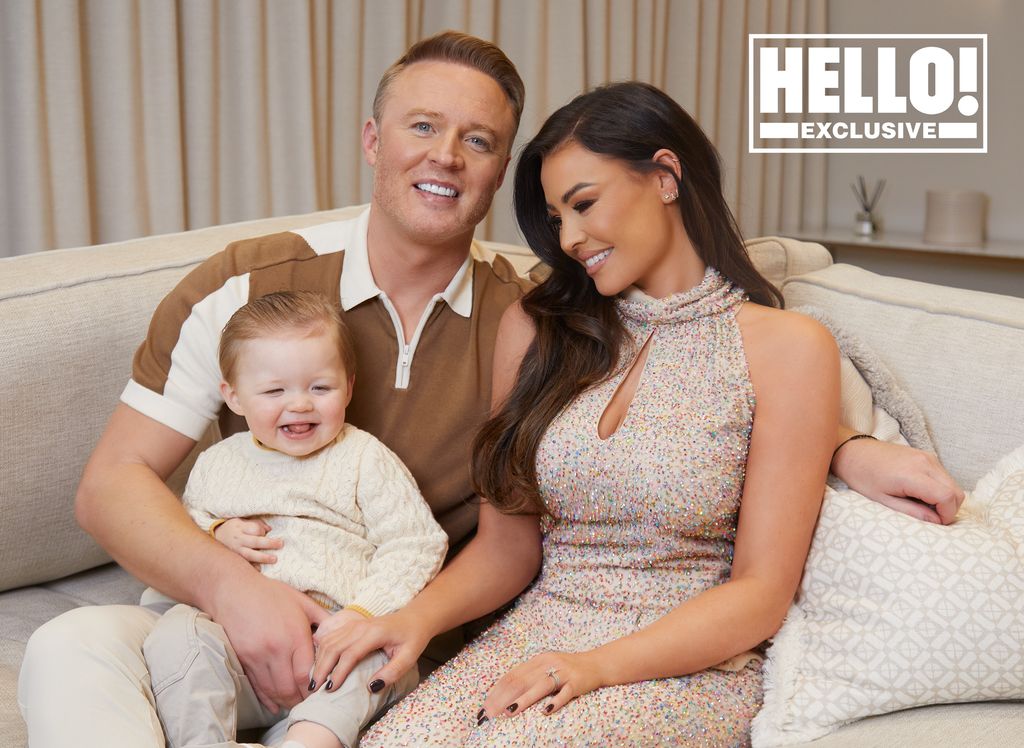 Jessica Wright sitting on cream sofa with husband William Lee Kemp and son Presley