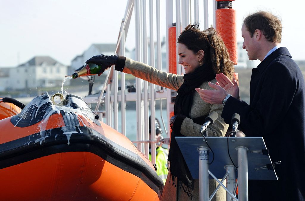 Kate Middleton pouring champagne on boat