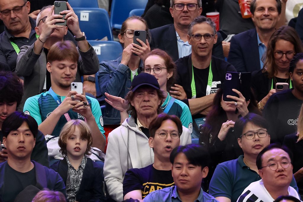 Mick and his son watch the fencing competition during the Paris 2024 Olympic Games