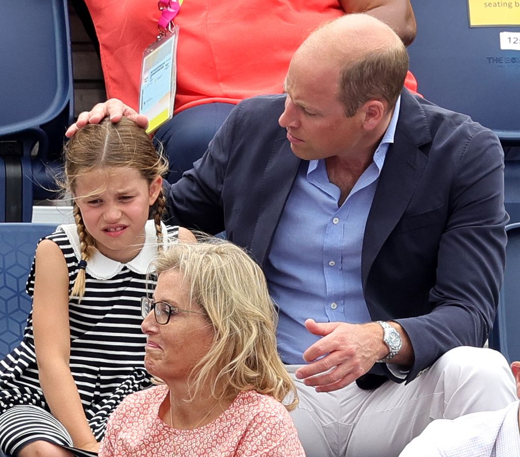 William resting a gentle hand on Charlotte's head