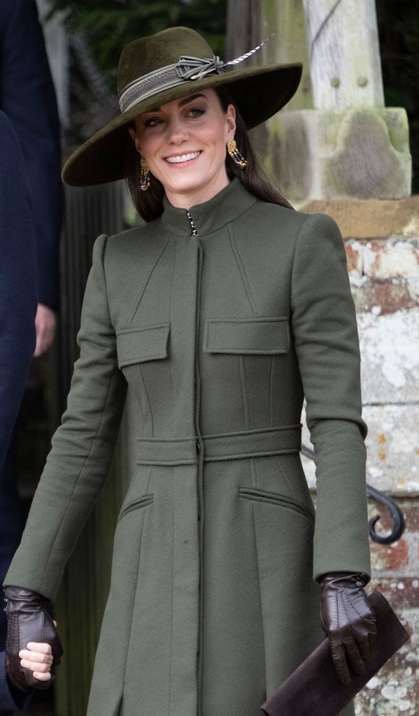 Kate wearing green coat and fedora hat in Sandringham