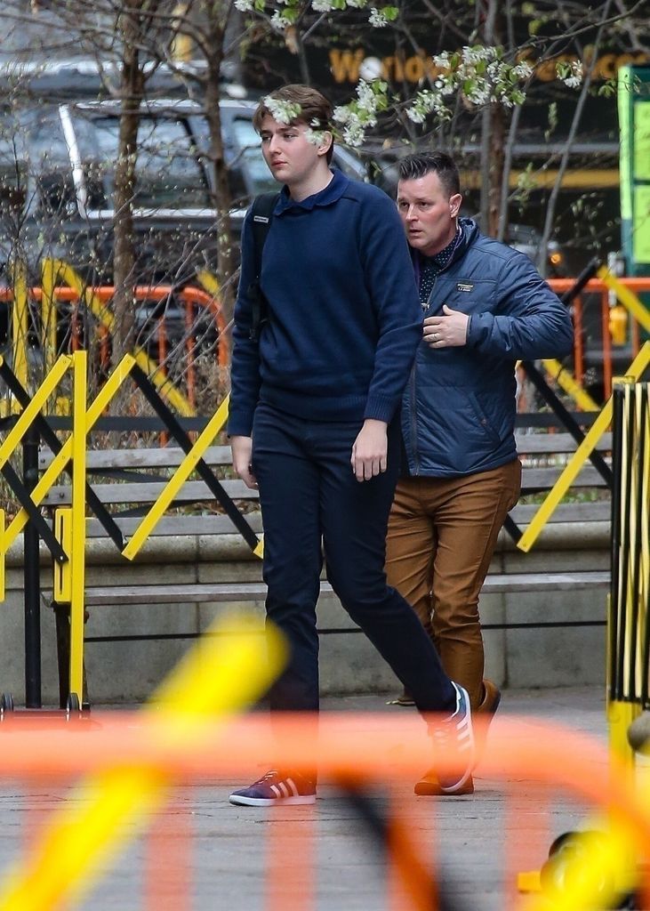 Going incognito in NY walking with security behind him