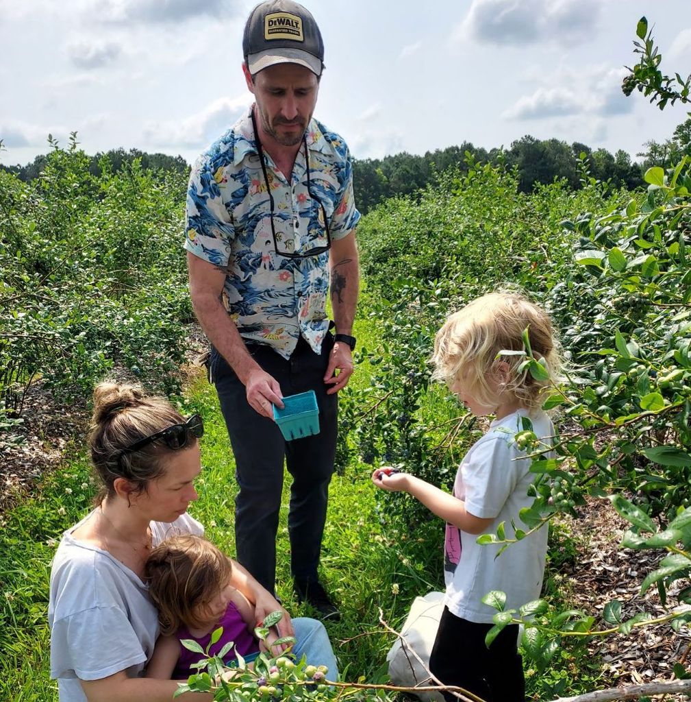photo of james ransone and family in a field