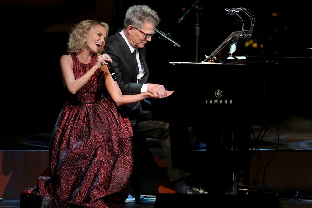 Kristin Chenoweth and David Foster perform onstage at a PBS SoCal Holiday Celebration on December 10, 2014 in Hollywood, California