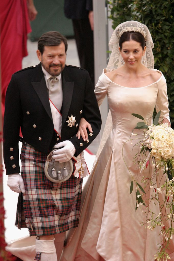 Mary walks down the aisle with her father Dr. John Donaldson at her 2004 wedding to Frederik