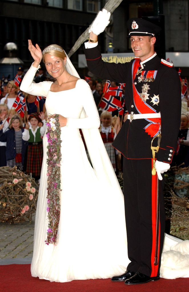 Crown Prince Haakon Of Norway & Mette-Marit waving