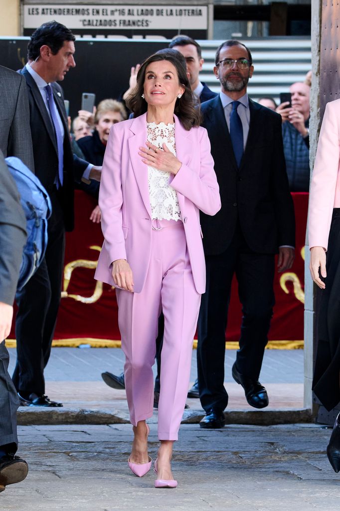 Queen Letizia of Spain walking in lilac suit 