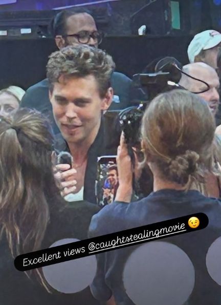 Blurry photo of Austin Butler speaking to media