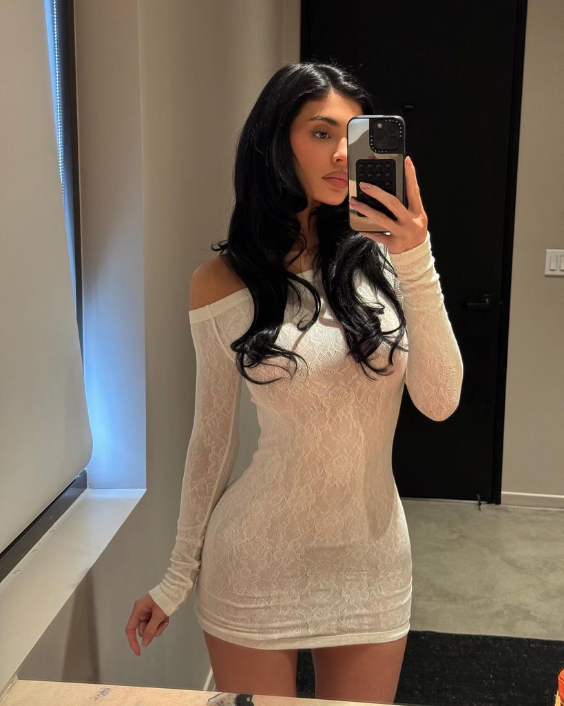 Kylie stunned in an etheral lcae white mini dress