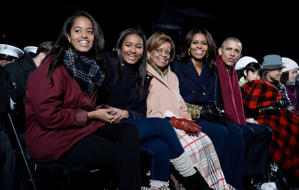 The President Barack Obama and (L-R) daughters Malia and Sasha, mother-in-law Marian Robinson and first lady Michelle Obama look on during the national Christmas tree lighting ceremony on the Ellipse south of the White House December 3, 2015 in Washington, DC. The lighting of the tree is an annual tradition attended by the president and the first family.