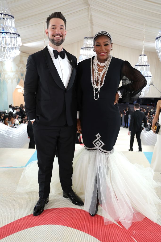 Serena Williams and Alexis Ohanian smiling on the red carpet of the Met Gala