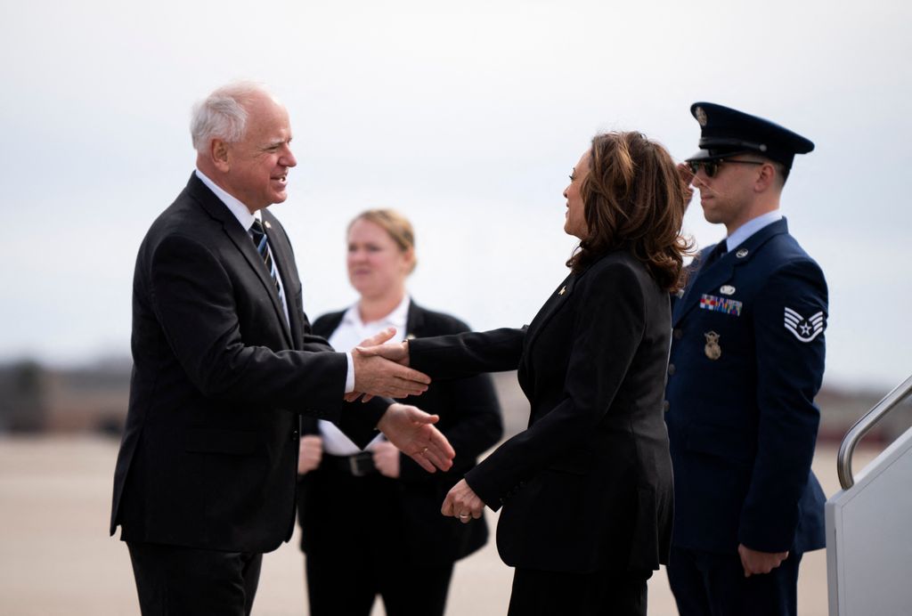 Minnesota Governor Tim Walz greets US Vice President Kamala Harris as she arrives at the Minneapolis-St. Paul International Airport in Saint Paul, Minnesota, on March 14, 2024