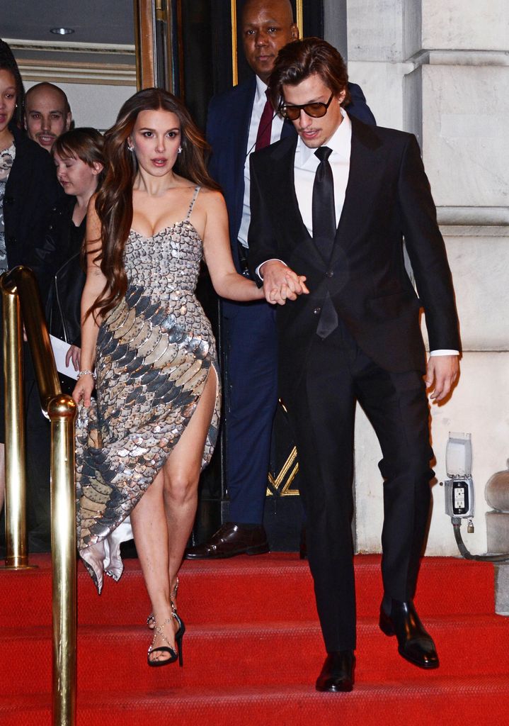 Millie Bobby Brown in croc-effect dress and Jake Bongiovi in black suit in New York