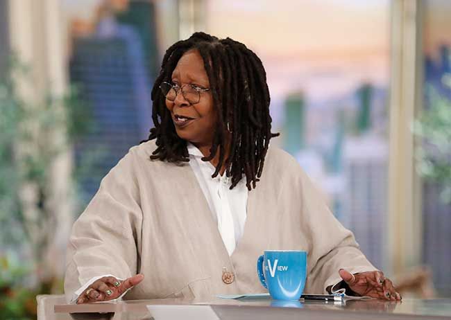 Whoopi Goldberg with her glasses on hosting The View