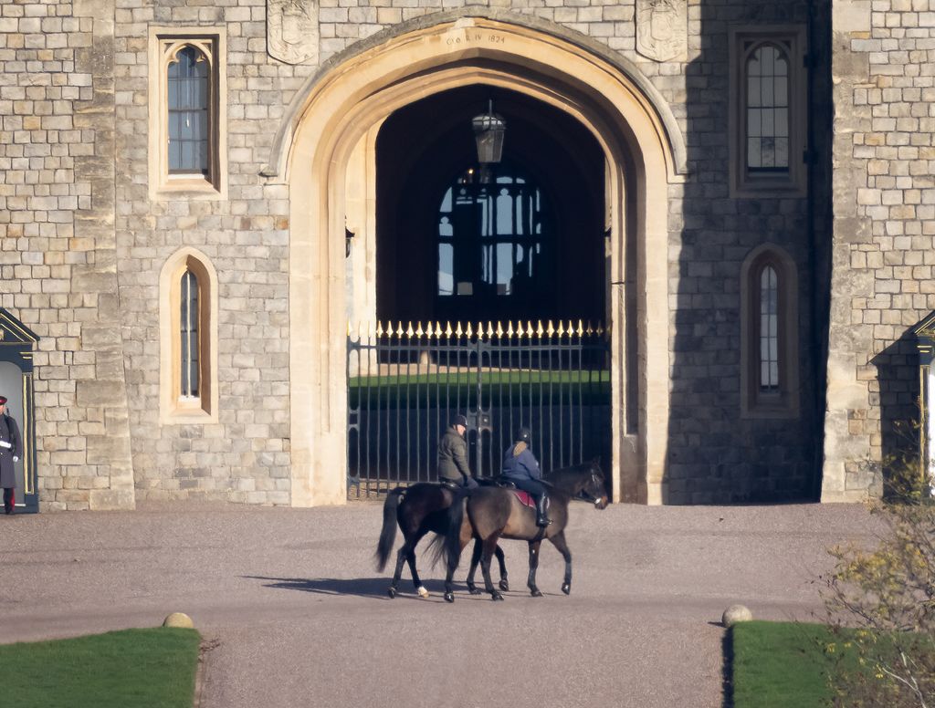 Andrew Mountbatten Windsor is seen out riding with a groom at Windsor Castle today for the first time since losing his royal titles. 