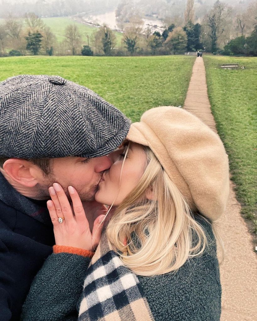 Mollie King kissing her fiance with her engagement ring on her finger