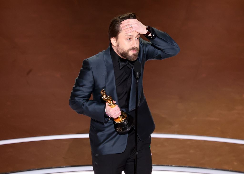 Kieran Culkin holds his hand to his forehand in shock after collecting his Best Actor award at the 97th Oscars held at the Dolby Theatre on March 2, 2025 in Hollywood, California