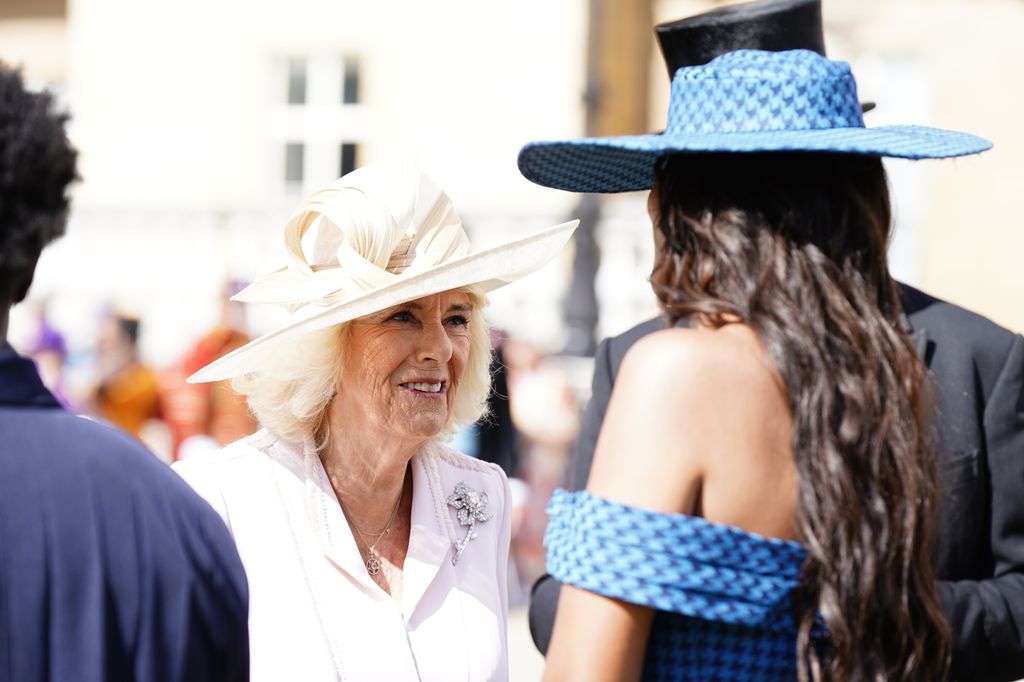 Queen Camilla talks with Maya Jama at The Creative Industries Garden Party at Buckingham Palace on May 15, 2024 