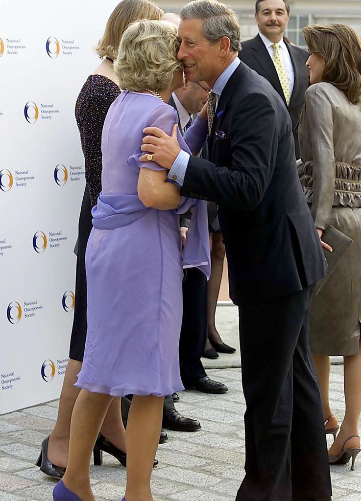 Camilla welcomes Charles to Somerset House with a kiss on the cheek