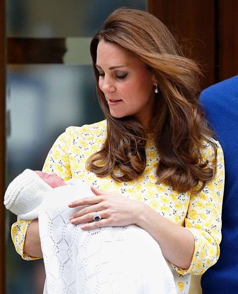 Kate Middleton holding a baby Princess Charlotte