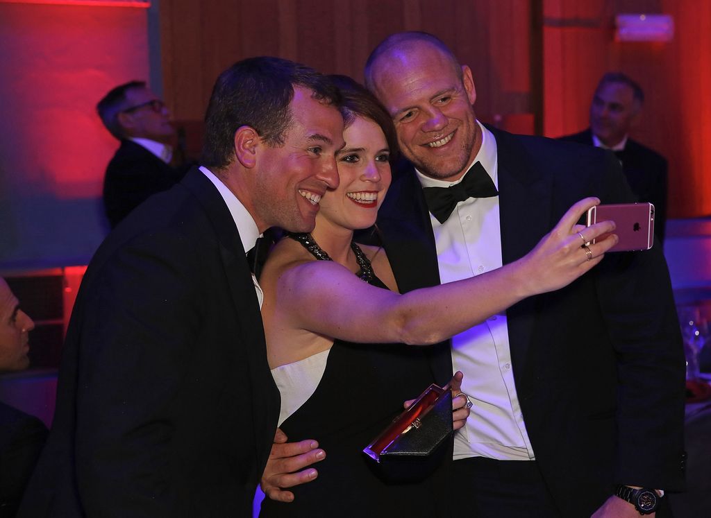 Princess Eugenie and Mike Tindall taking a selfie with Peter Phillips
