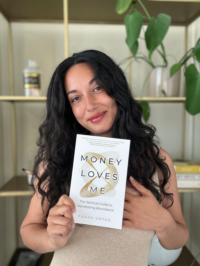 Farah Orths, author of 'Money Loves Me', poses with her book