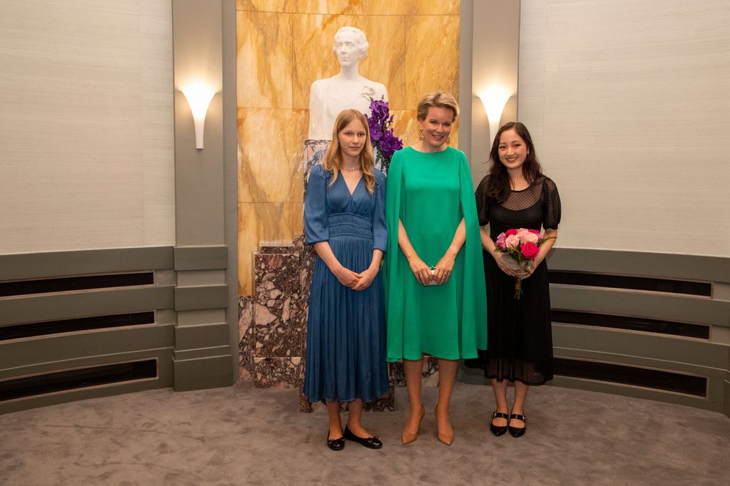 Princess Eleonore in a blue dress with Queen Mathilde of Belgium 